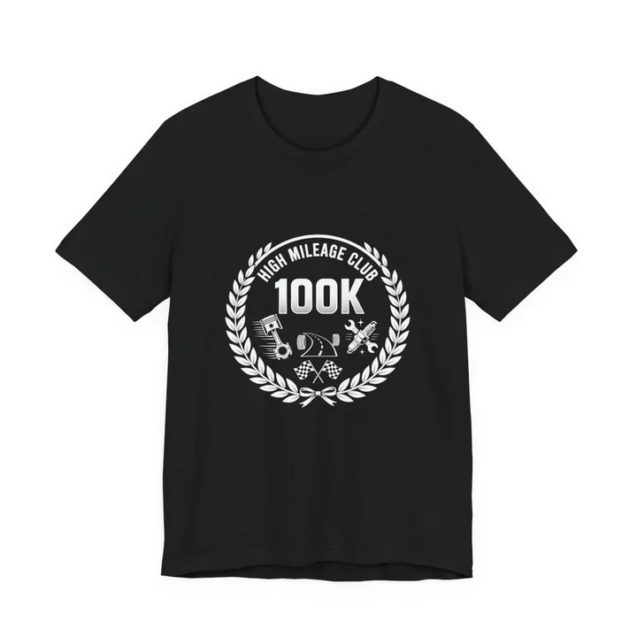 High Mileage Club 100K Tee mockup: the print on a black Bella+Canvas 3001 tee
